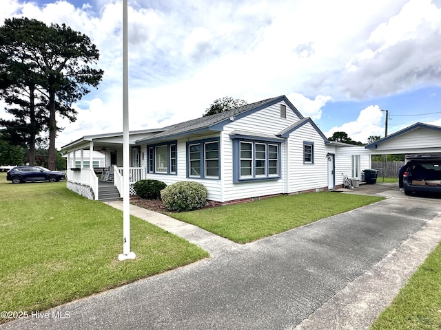 706 E Country Club Dr, Tarboro, NC 27886 - view of property exterior featuring a yard and covered porch