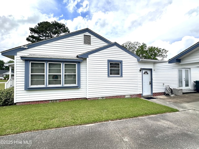 706 E Country Club Dr, Tarboro, NC 27886 - view of front of home featuring a patio area, french doors, a front lawn, and crawl space