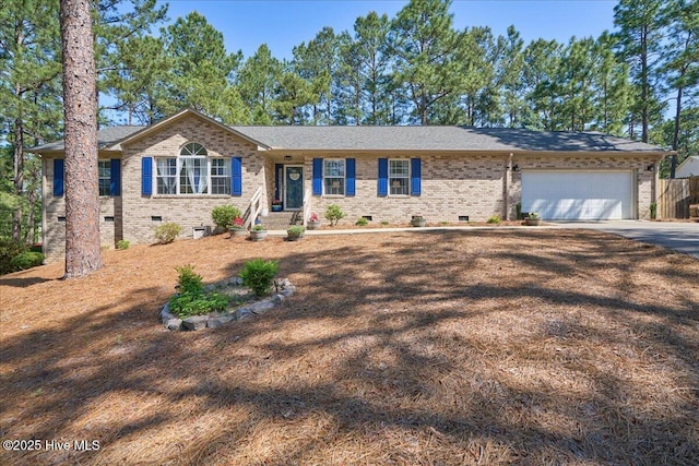 4 Brunswick Ln, Pinehurst, NC 28374 - single story home with crawl space, concrete driveway, an attached garage, brick siding, and fence