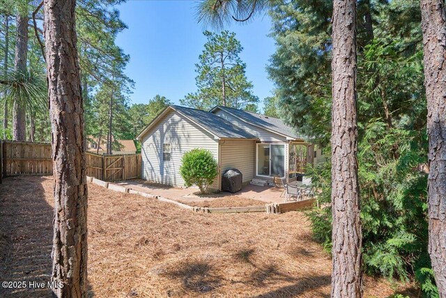 4 Brunswick Ln, Pinehurst, NC 28374 - back of property featuring a patio area and fence