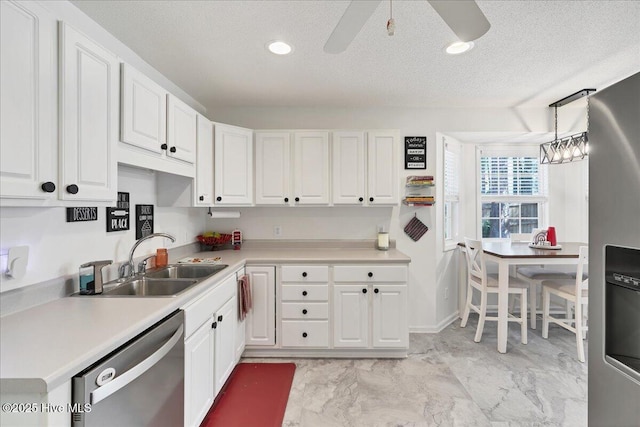 4 Brunswick Ln, Pinehurst, NC 28374 - kitchen with stainless steel dishwasher, a sink, white cabinetry, light countertops, and recessed lighting