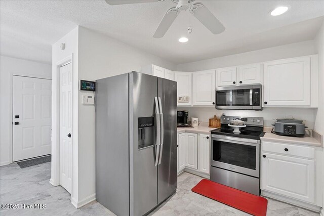 4 Brunswick Ln, Pinehurst, NC 28374 - kitchen featuring appliances with stainless steel finishes, white cabinets, light countertops, a ceiling fan, and recessed lighting