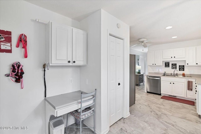 4 Brunswick Ln, Pinehurst, NC 28374 - kitchen featuring stainless steel dishwasher, a ceiling fan, white cabinetry, a sink, and baseboards
