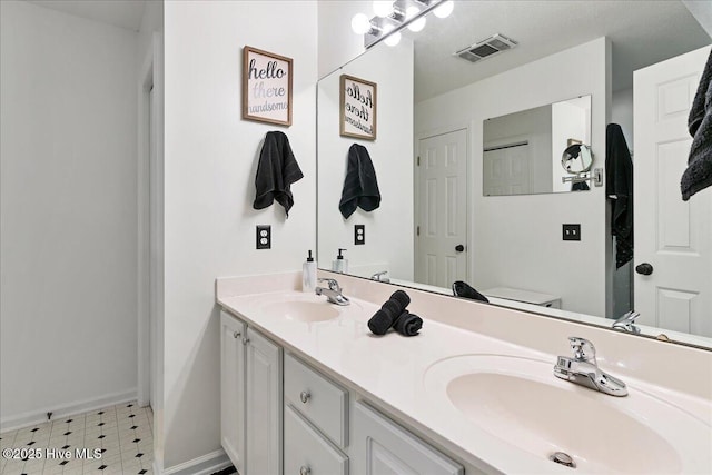 4 Brunswick Ln, Pinehurst, NC 28374 - bathroom with tile patterned floors, double vanity, and baseboards