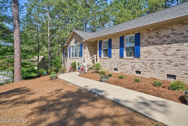4 Brunswick Ln, Pinehurst, NC 28374 - view of front of home featuring crawl space, brick siding, and a shingled roof