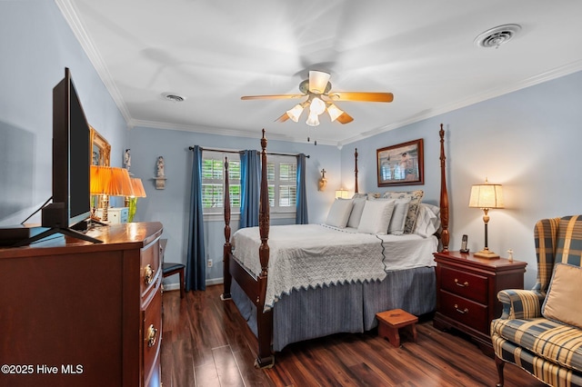 104 N Reed Dr, Washington, NC 27889 - bedroom with crown molding, dark wood-style floors, and a ceiling fan