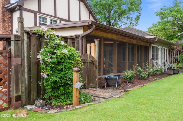 104 N Reed Dr, Washington, NC 27889 - view of side of home featuring a sunroom, stucco siding, and roof with shingles