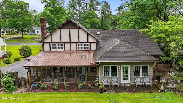 104 N Reed Dr, Washington, NC 27889 - rear view of house with a sunroom, roof with shingles, a gate, and a wooden deck