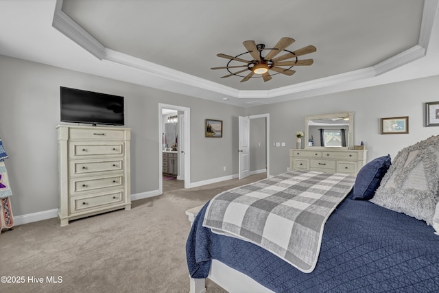 bedroom featuring a tray ceiling, crown molding, baseboards, and carpet
