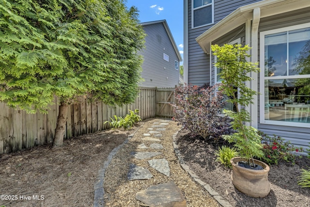 view of yard featuring a gate and fence