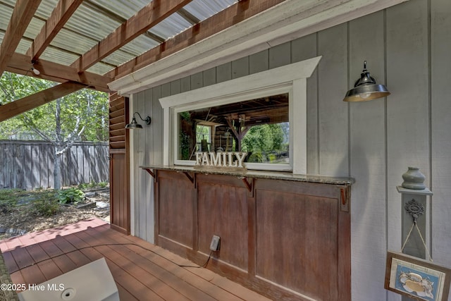 wooden deck featuring fence
