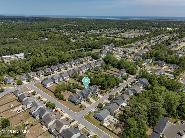 aerial view featuring a view of trees and a residential view