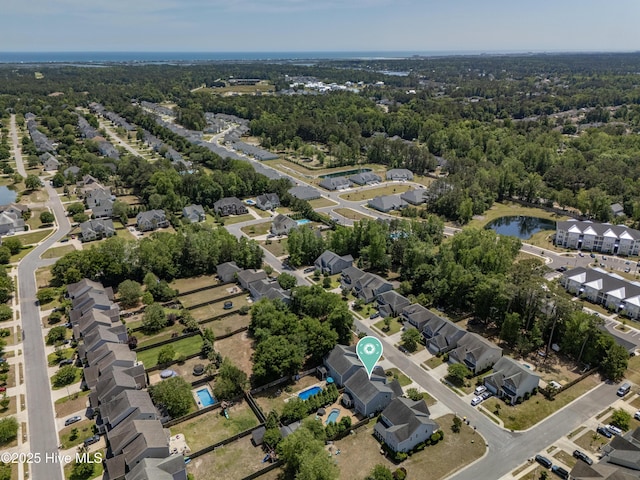 bird's eye view with a water view and a residential view
