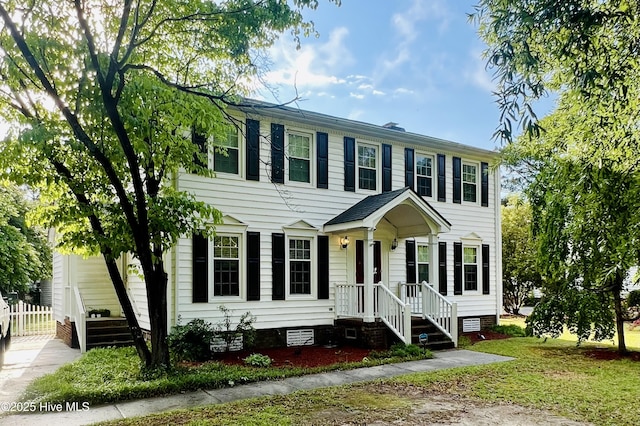 colonial inspired home with crawl space and fence