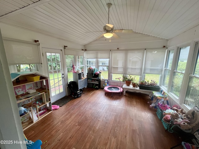 sunroom / solarium with vaulted ceiling, wood finished floors, french doors, and wood ceiling