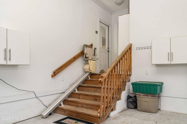 stairway featuring unfinished concrete floors