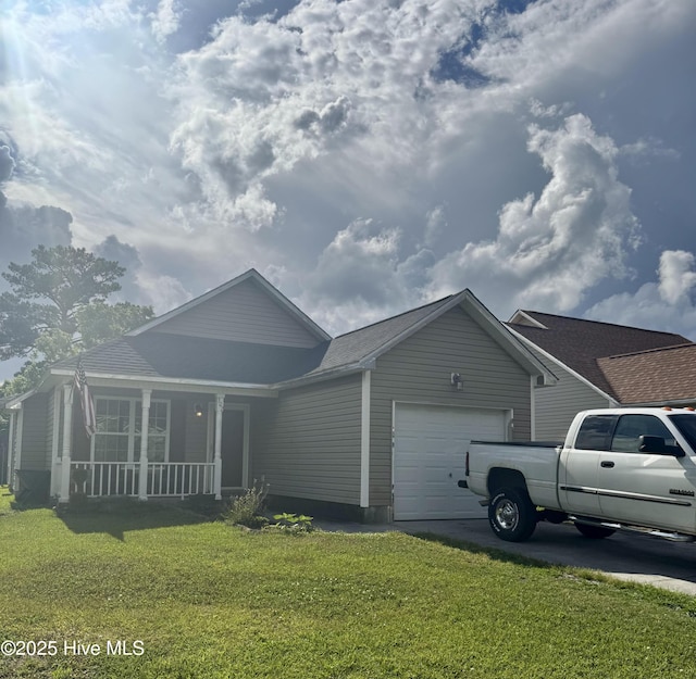 exterior space featuring a yard, driveway, covered porch, and an attached garage