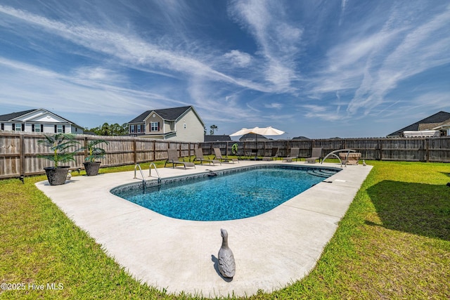 view of swimming pool featuring a yard, a fenced in pool, a patio, a residential view, and a fenced backyard