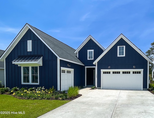 1545 St Lucia Dr SW, Shallotte, NC 28470 - modern farmhouse with concrete driveway, board and batten siding, and a shingled roof