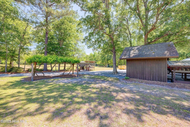 view of grassy yard featuring a playground