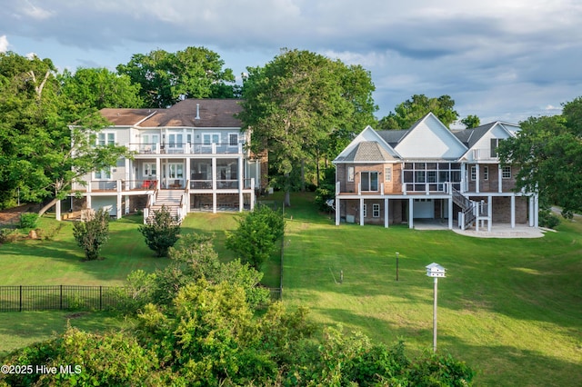 1835 Middle Sound Loop Rd, Wilmington, NC 28411 - back of property featuring stairs, a sunroom, and a balcony