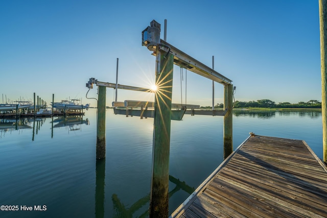 dock area featuring a water view and boat lift