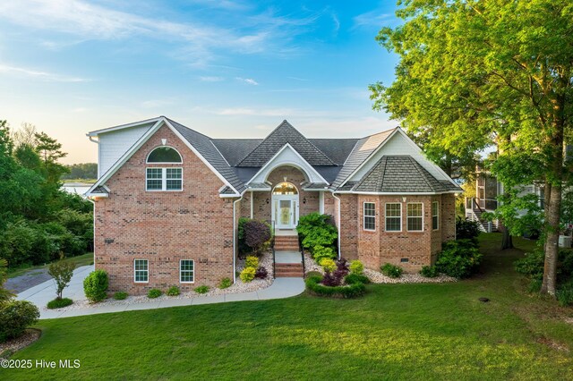 1835 Middle Sound Loop Rd, Wilmington, NC 28411 - view of front of property with brick siding, a front yard, and crawl space