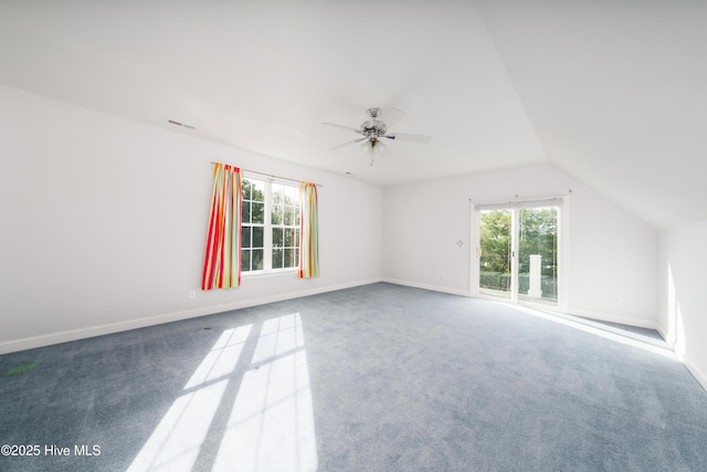 1835 Middle Sound Loop Rd, Wilmington, NC 28411 - empty room featuring carpet, healthy amount of natural light, lofted ceiling, ceiling fan, and baseboards