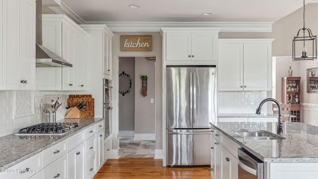 216 National Dr, Pinehurst, NC 28374 - kitchen featuring appliances with stainless steel finishes, a sink, white cabinetry, crown molding, and recessed lighting