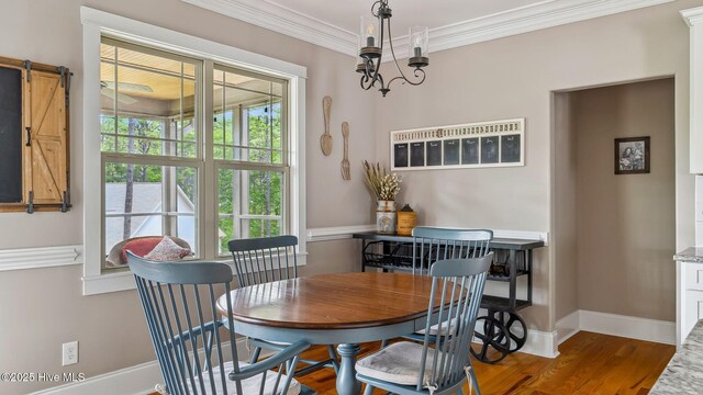 216 National Dr, Pinehurst, NC 28374 - dining room with wood finished floors, crown molding, and baseboards