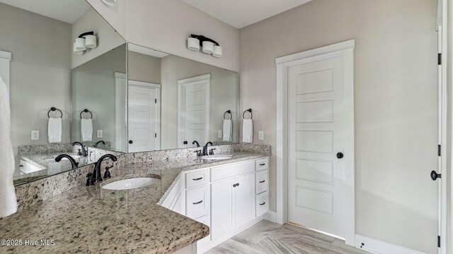 216 National Dr, Pinehurst, NC 28374 - full bath featuring baseboards and double vanity