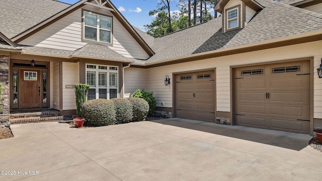 216 National Dr, Pinehurst, NC 28374 - view of front of home with a shingled roof, concrete driveway, and a garage