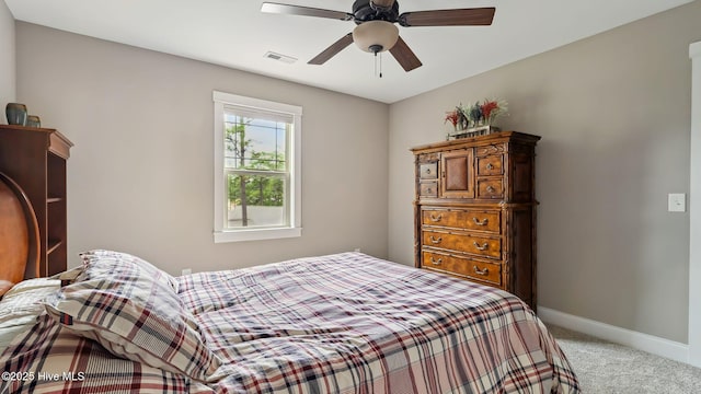 216 National Dr, Pinehurst, NC 28374 - bedroom featuring light colored carpet, baseboards, and a ceiling fan