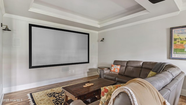 216 National Dr, Pinehurst, NC 28374 - home theater featuring wood finished floors, a tray ceiling, crown molding, and baseboards