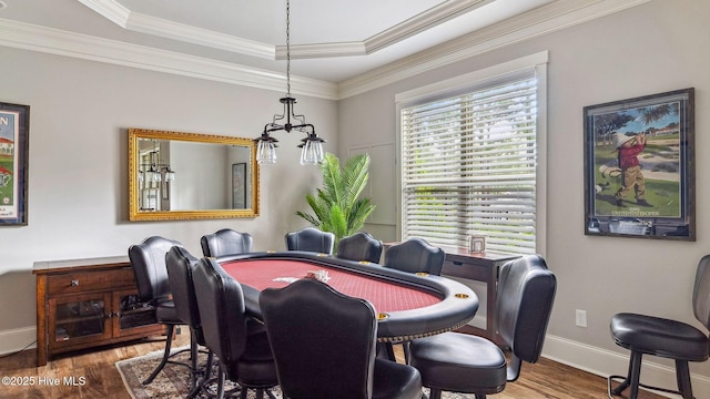 216 National Dr, Pinehurst, NC 28374 - dining area featuring wood finished floors, baseboards, crown molding, and a tray ceiling