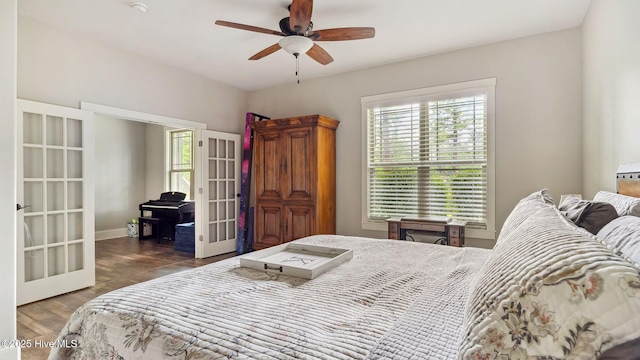 216 National Dr, Pinehurst, NC 28374 - bedroom featuring french doors, wood finished floors, and ceiling fan