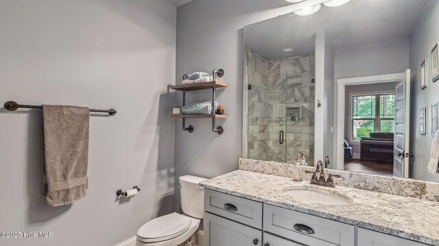 216 National Dr, Pinehurst, NC 28374 - full bath featuring a stall shower, toilet, vanity, and baseboards