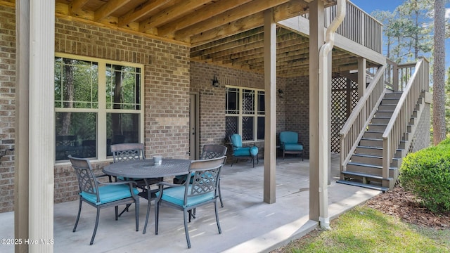 216 National Dr, Pinehurst, NC 28374 - view of patio with stairs and outdoor dining space