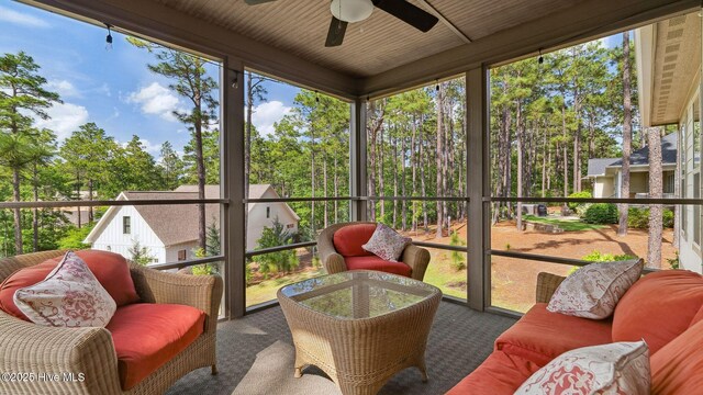 216 National Dr, Pinehurst, NC 28374 - sunroom with ceiling fan, view of scattered trees, and an outdoor living space