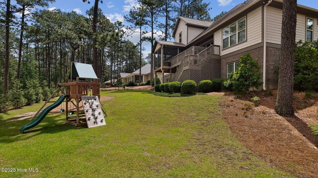 216 National Dr, Pinehurst, NC 28374 - view of green lawn featuring a playground