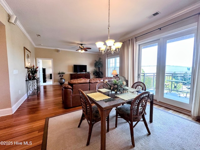 6832 Main St Unit 317, Wilmington, NC 28405 - dining area with a chandelier, light wood-type flooring, ornamental molding, and ceiling fan