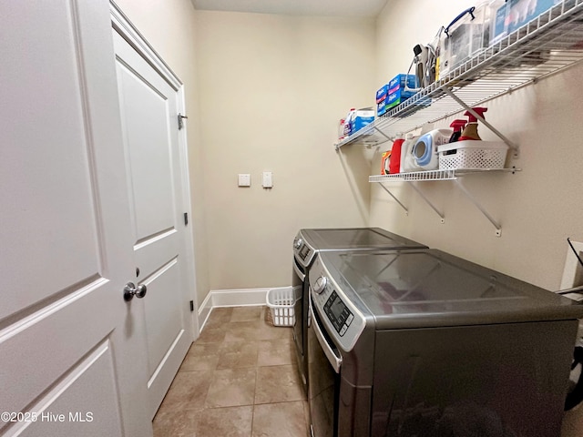 6832 Main St Unit 317, Wilmington, NC 28405 - washroom with washer and clothes dryer and baseboards