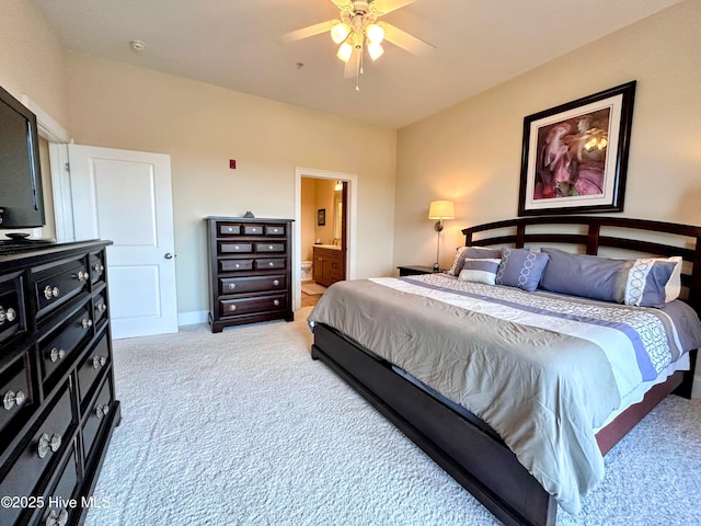 6832 Main St Unit 317, Wilmington, NC 28405 - bedroom featuring light colored carpet, connected bathroom, and ceiling fan