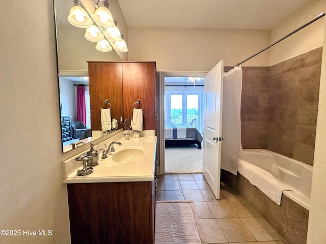 6832 Main St Unit 317, Wilmington, NC 28405 - ensuite bathroom featuring vanity, tiled shower / bath combo, tile patterned floors, and french doors