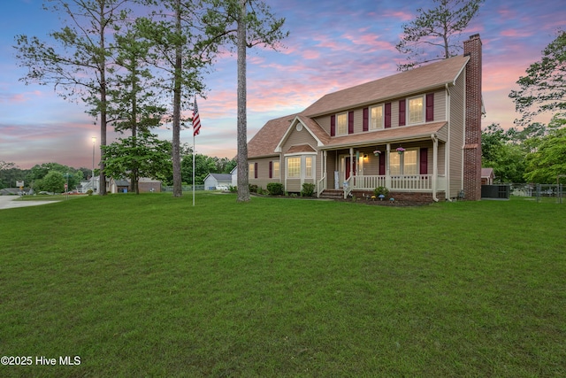 2290 Dockvale Dr, Fayetteville, NC 28306 - view of front of home with covered porch and a chimney
