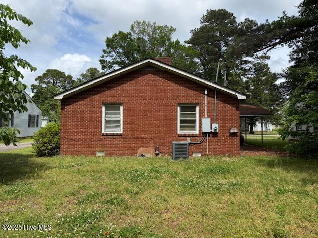 113 Winesett Cir, Plymouth, NC 27962 - view of side of property featuring brick siding, a lawn, cooling unit, and crawl space