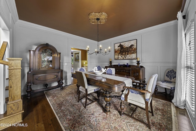 390 Whitebridge Rd, Hampstead, NC 28443 - dining room with ornamental molding, hardwood / wood-style flooring, a decorative wall, and a notable chandelier