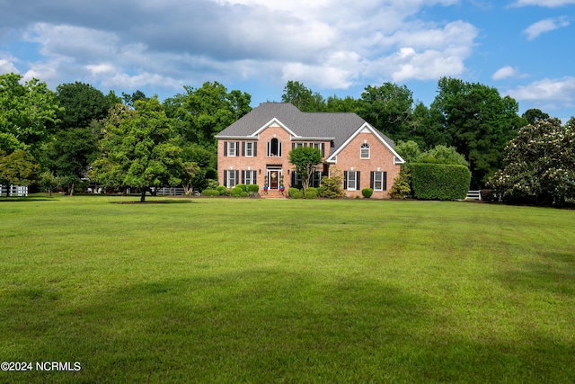 390 Whitebridge Rd, Hampstead, NC 28443 - colonial home with a front lawn and brick siding