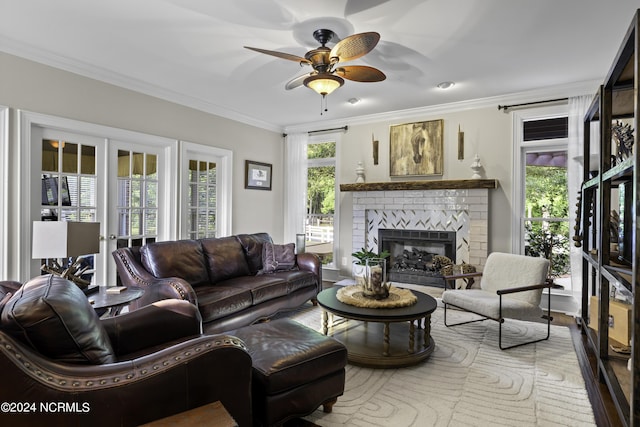 390 Whitebridge Rd, Hampstead, NC 28443 - living area featuring ornamental molding, a brick fireplace, a ceiling fan, and wood finished floors