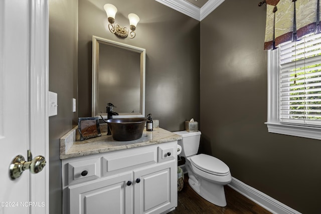 390 Whitebridge Rd, Hampstead, NC 28443 - bathroom featuring toilet, wood finished floors, baseboards, vanity, and ornamental molding